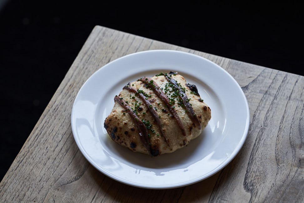https://www.datocms-assets.com/46385/1652874623-brat-restaurant-grilled-bread.jpeg?auto=format&fit=max&q=50&w=972