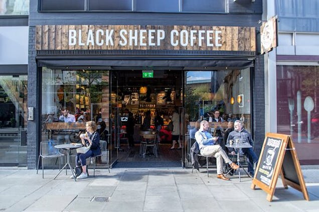https://www.datocms-assets.com/46385/1655810465-black-sheep-coffee.jpg?auto=format&fit=max&q=50&w=636