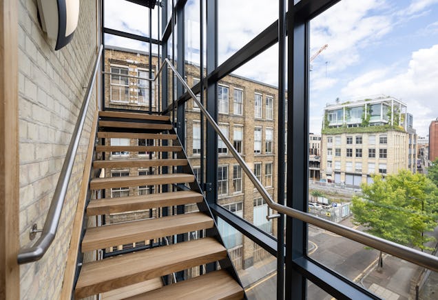 https://www.datocms-assets.com/46385/1660636472-shoreditch-stairs-view.jpg?auto=format&fit=max&q=50&w=636