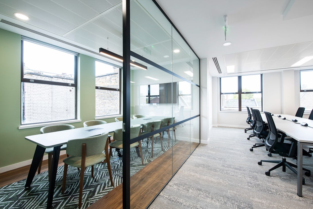 https://www.datocms-assets.com/46385/1699987174-18-desk-self-contained-suite.jpg?auto=format&fit=max&q=50&w=1092