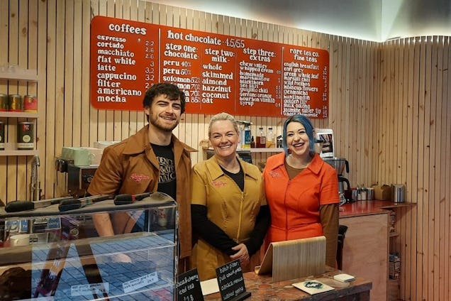 Staff members smiling at the camera in Ruby Hue Chocolate Maker's