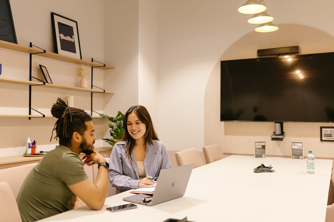 Two people in a meeting room at Runway East Birmingham
