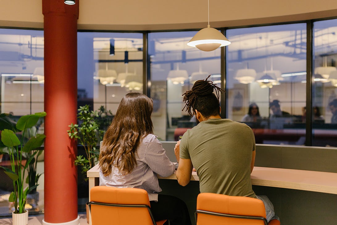 Two people working late at a serviced office at Runway East Birmingham