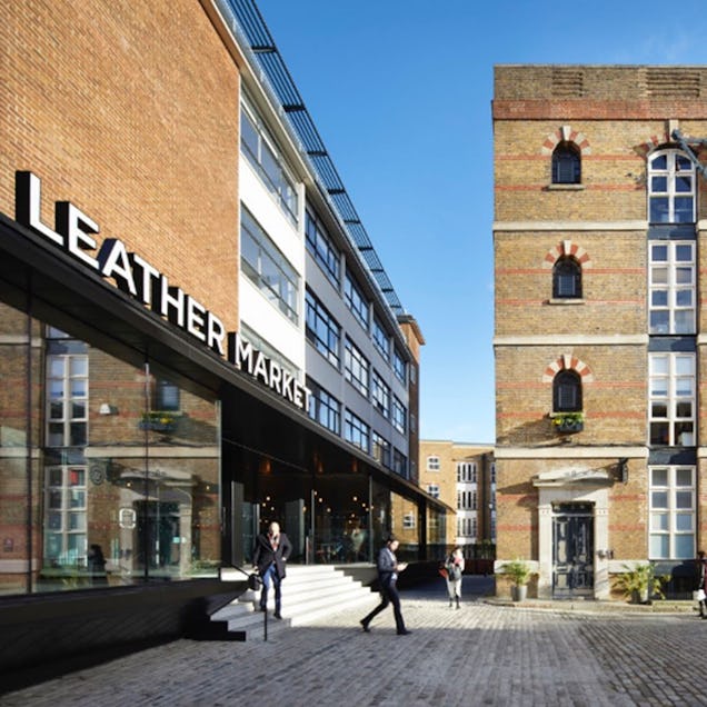 An image of the outside of the Leather Market, a brick building with the sign on the top awning.