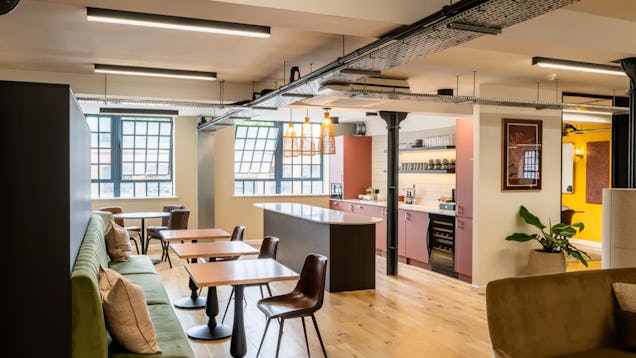 A breakout space and tea point image, with soft furnishing and cafe style tables.
