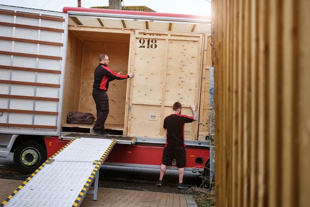 AJ Removals & Storage Workers Adjusting the Van
