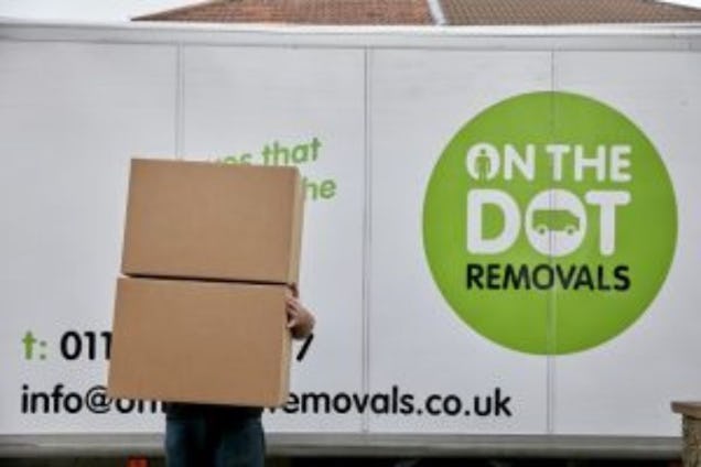 On The Dot Removals Van and Worker Carrying Boxes