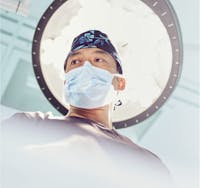 Dr. Shim Ching wearing surgical mask