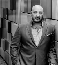 Black and white photo of Dr. Balinger in a suit