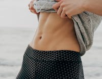 Woman lifting her shirt