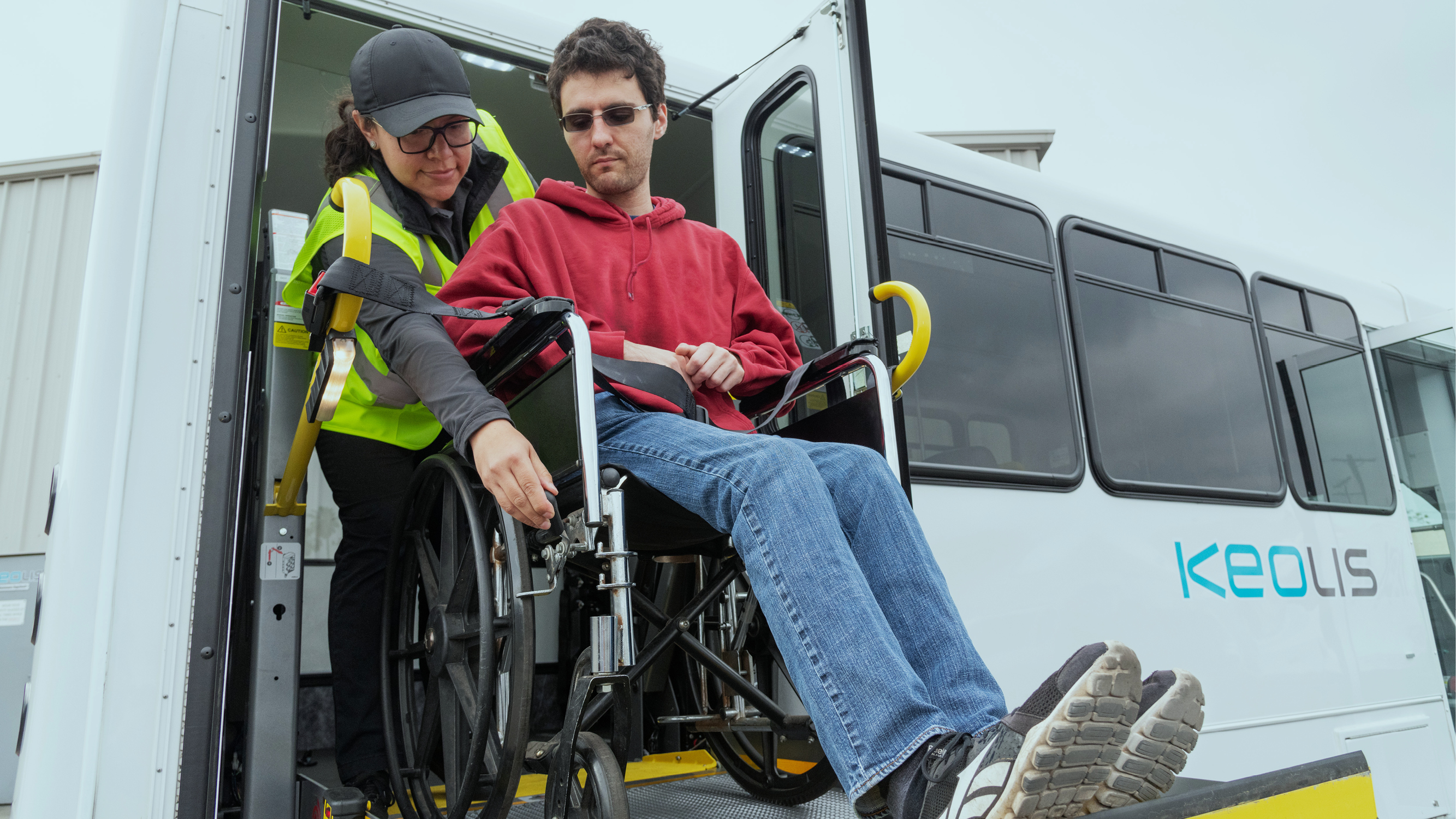 staff help a person with reduced mobility
