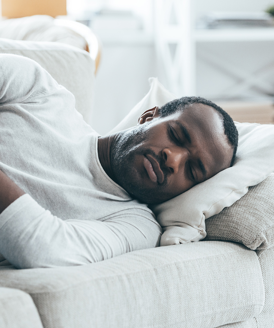 Middle aged man laying in bed, sleeping