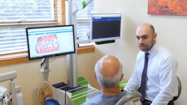 Dr. Samadian speaking with a patient about bone grafting in San Francisco