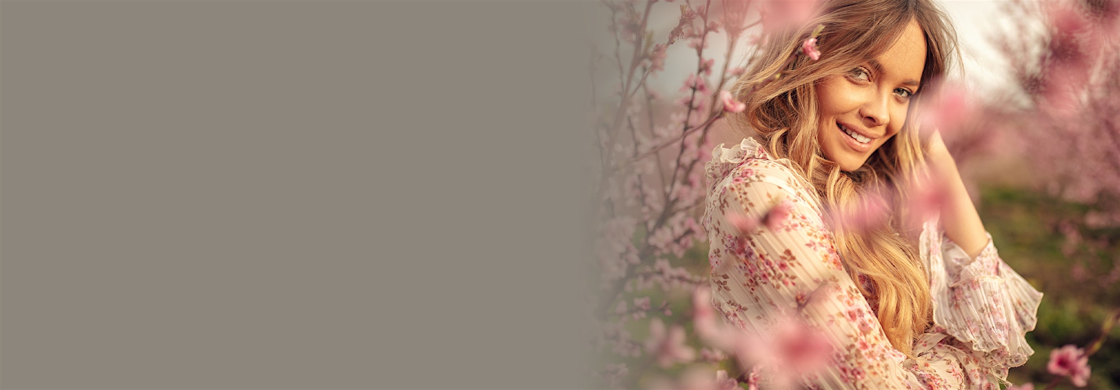woman surrounded by pink flowers