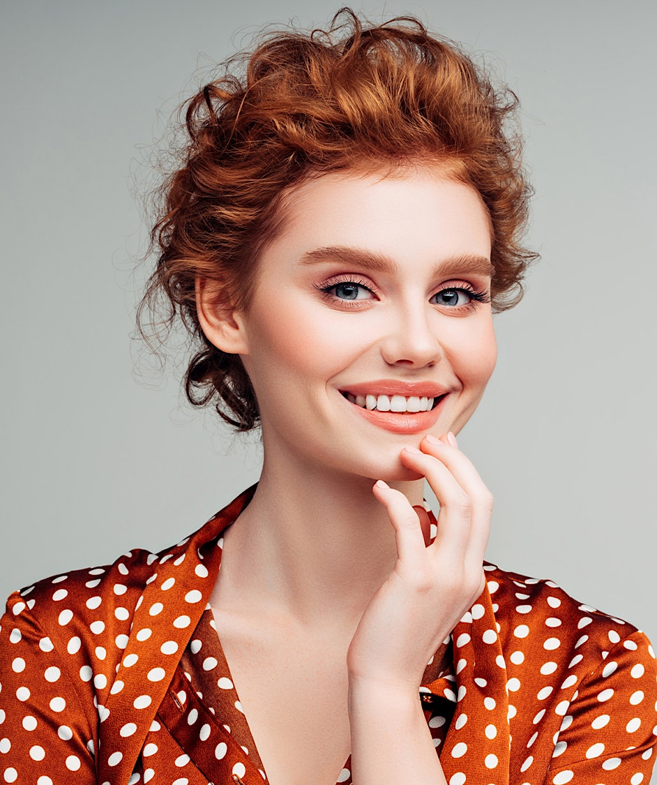 Beautiful woman with red hair smiling