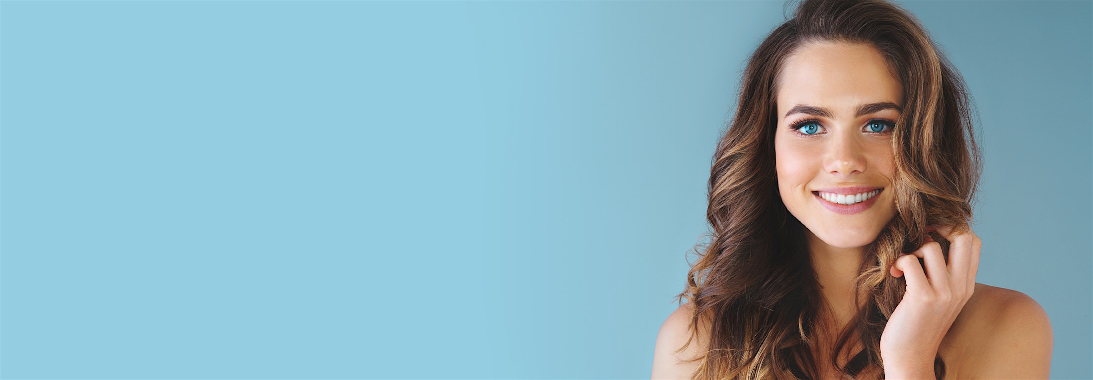Woman with curly hear, smiling with beautiful white teeth