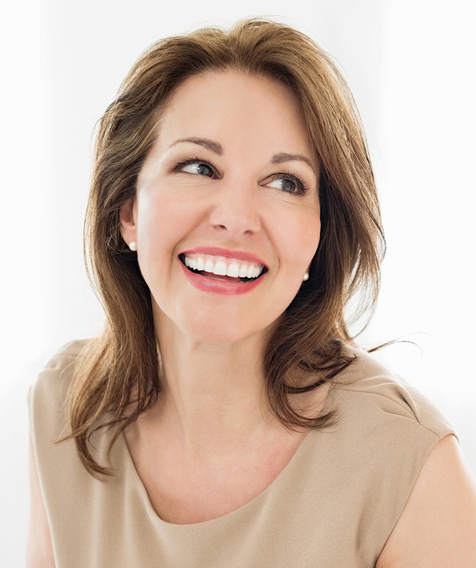 Woman with medium brown hair smiling