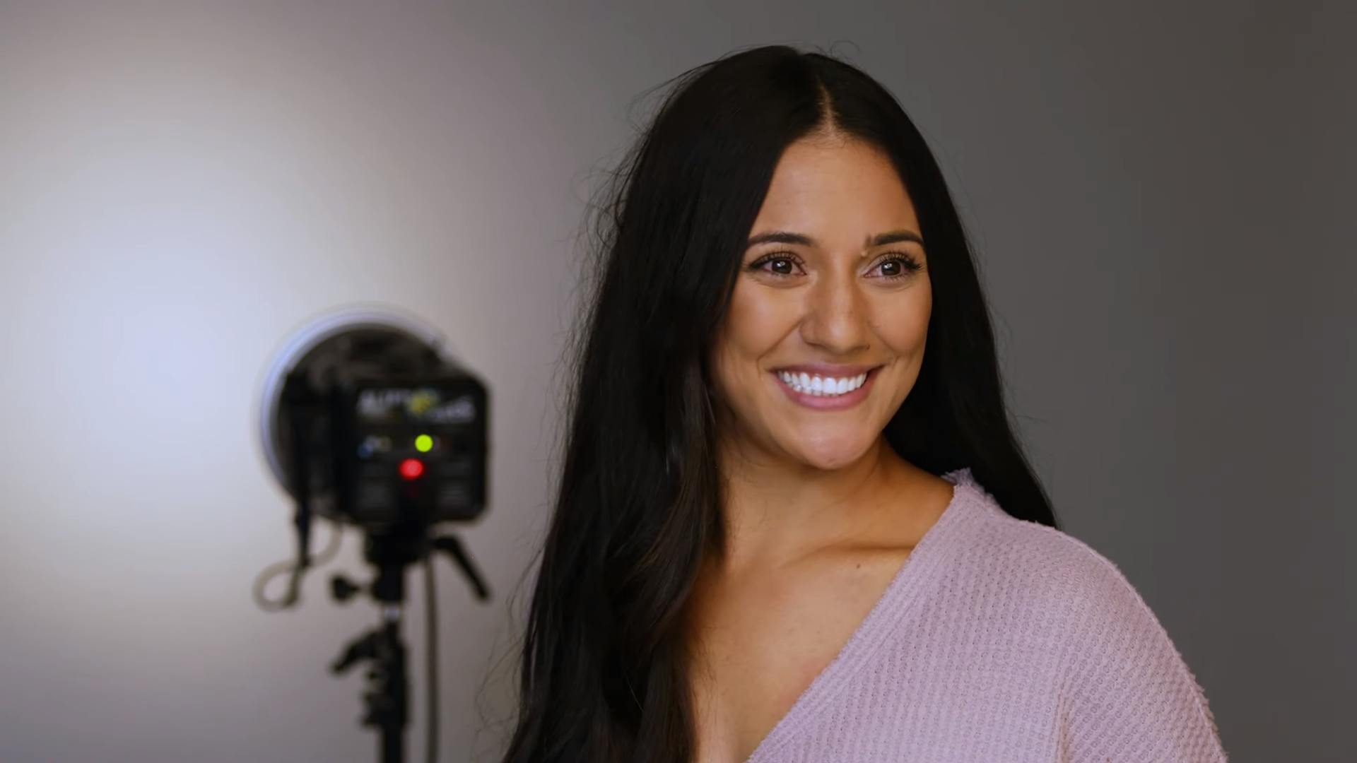 woman with long dark hair smiling