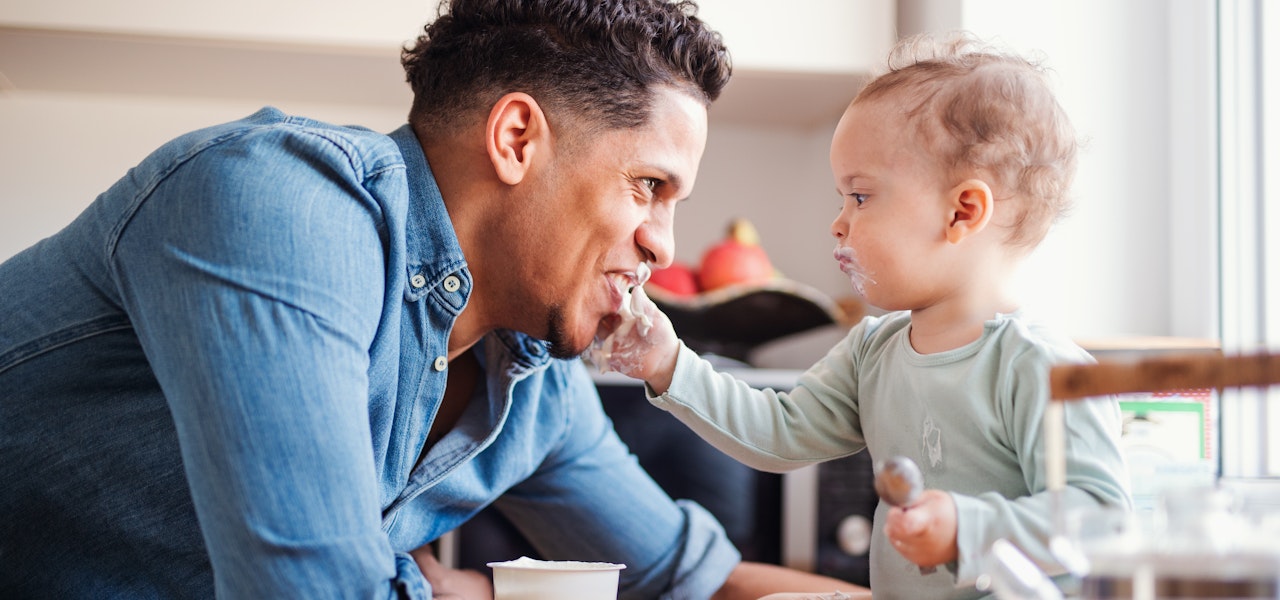 Man-and-baby-eating-yogurt