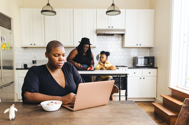 woman-on-computer-in-kitchen