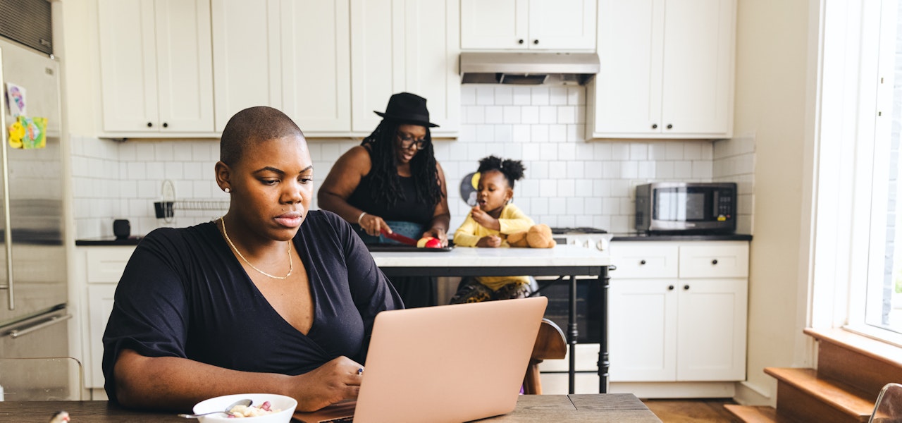 woman-on-computer-in-kitchen