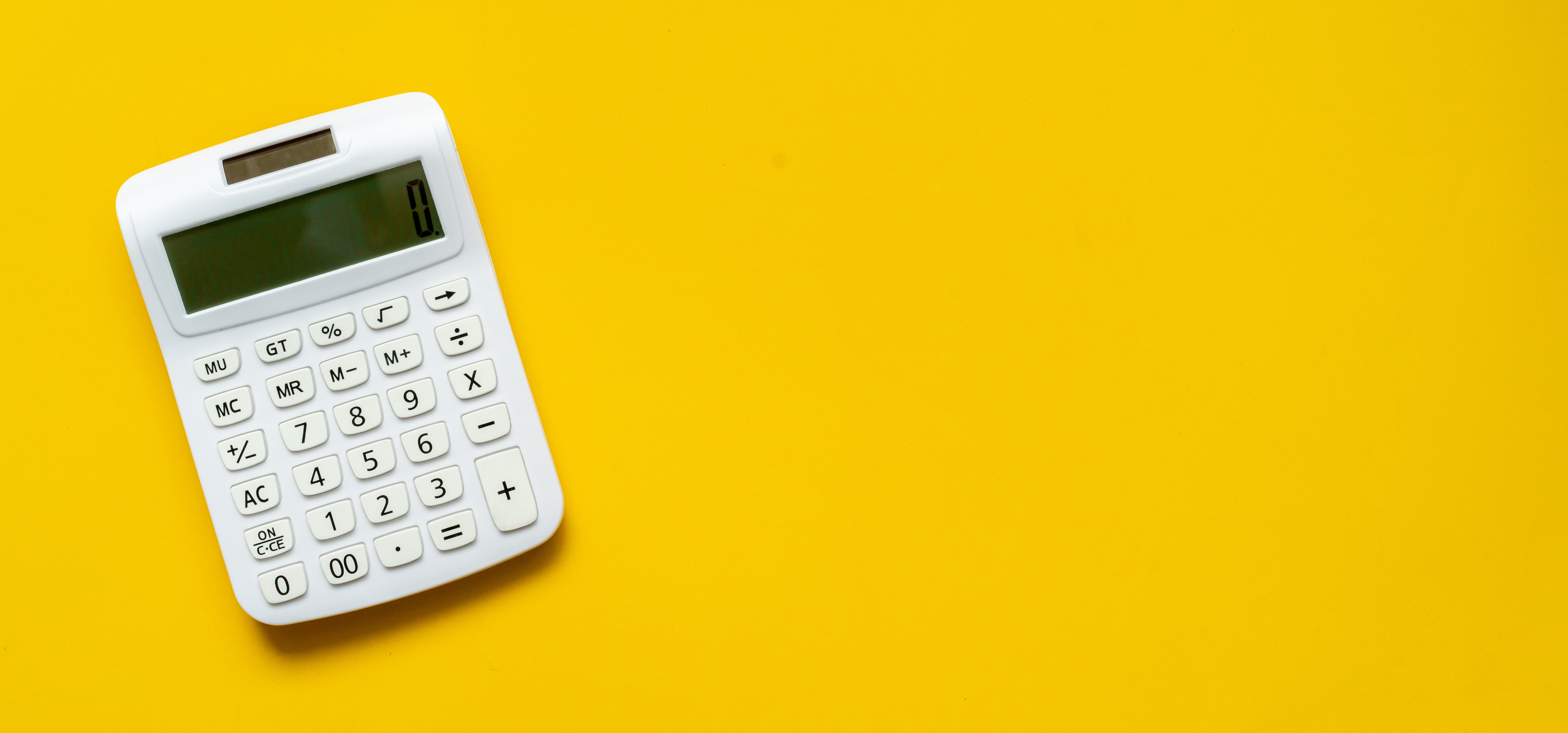 white-calculator-yellow-background