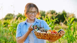 woman-carrying-bowl-of-vegetables