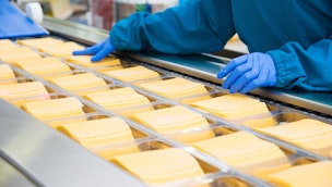 someone-working-in-a-processed-cheese-factory