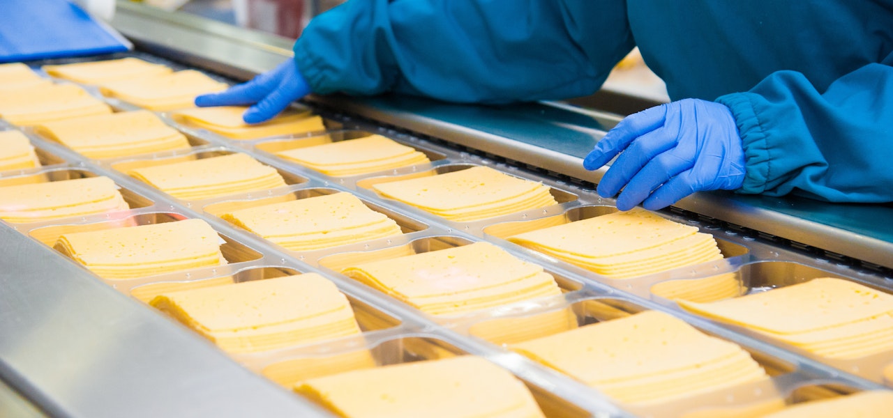 someone-working-in-a-processed-cheese-factory