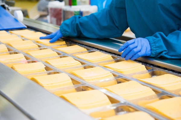 someone-working-in-a-processed-cheese-factory