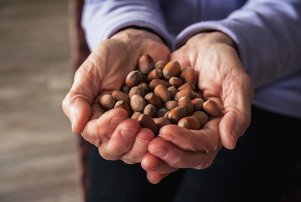 older-adult-holding-nuts