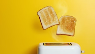 toast-popping-up-yellow-background