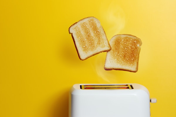 toast-popping-up-yellow-background