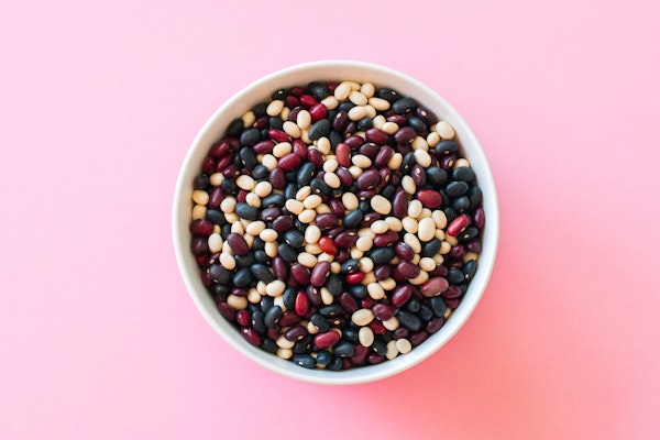 bowl-of-beans-pink-background