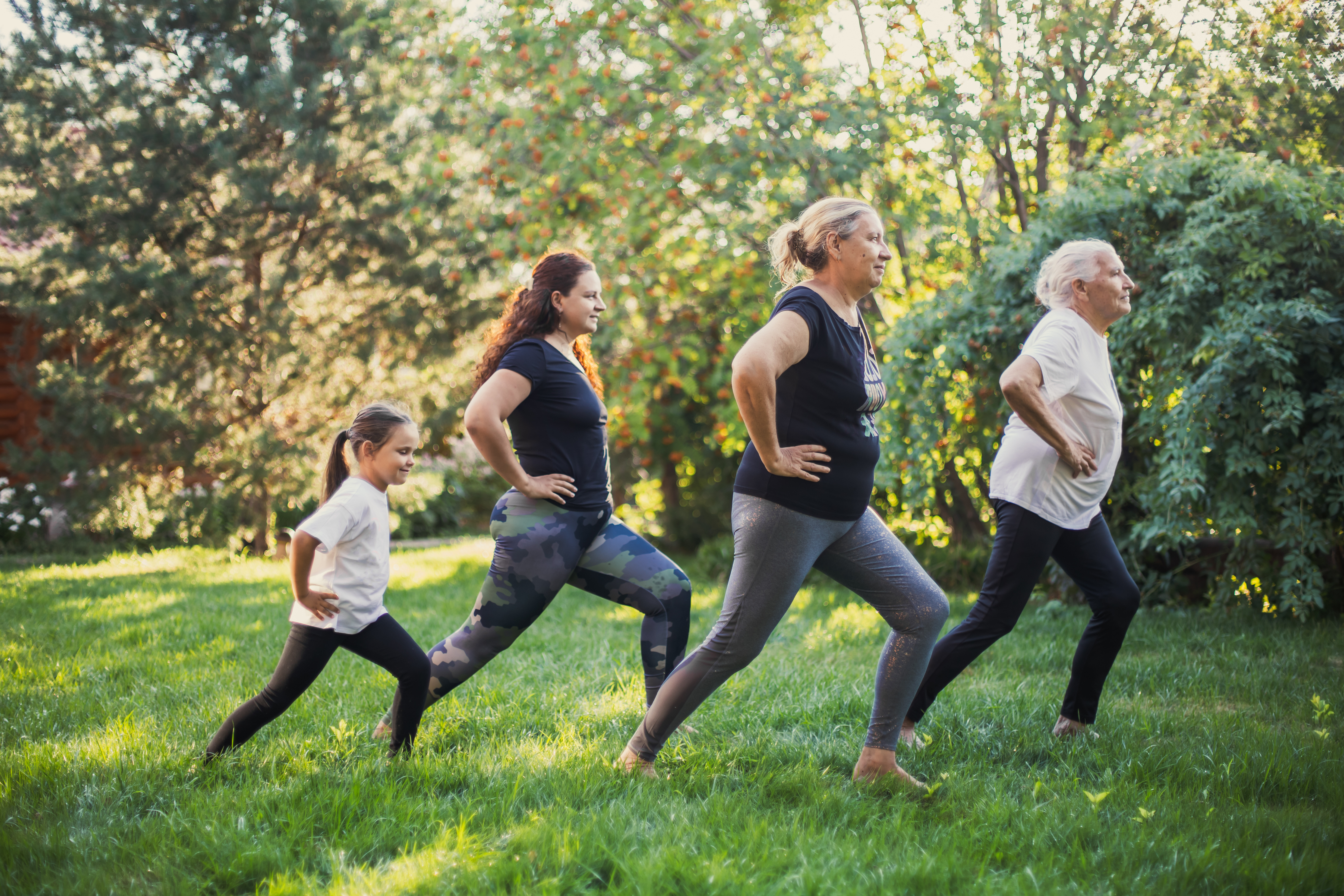 women-of-several-generations-doing-yoga