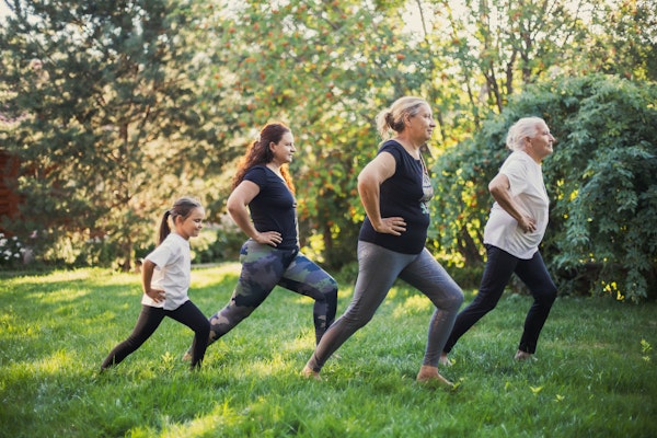 women-of-several-generations-doing-yoga