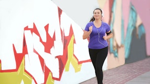 a person jogging next to street art