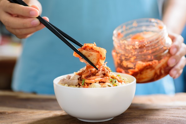 someone-serving-kimchi