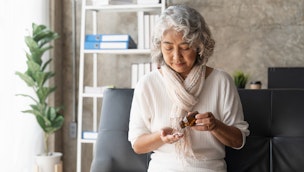 older-woman-taking-pills