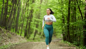 woman-running-in-forest