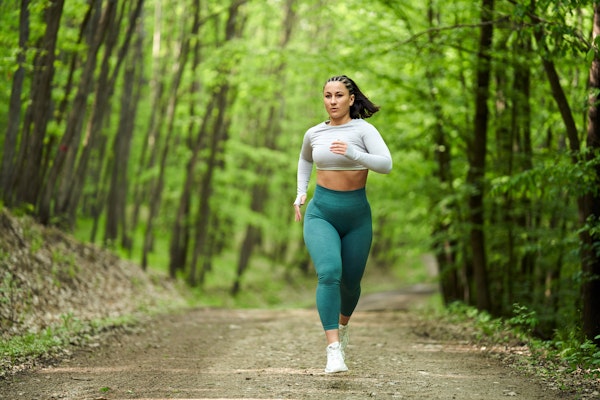 woman-running-in-forest