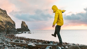 man-balancing-on-a-log