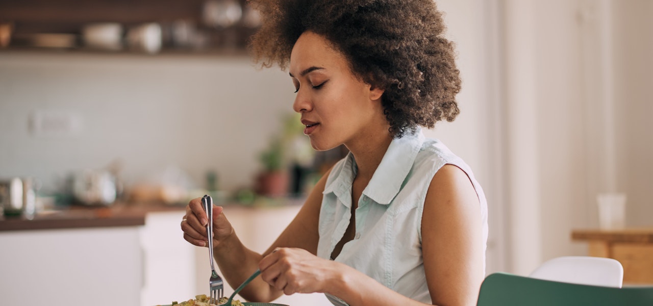 woman-at-table-practicing-mindful-eating