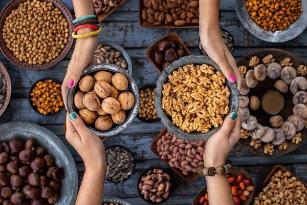 two-people-sharing-bowls-of-nuts