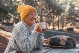 older-adult-drinking-coffee-outside