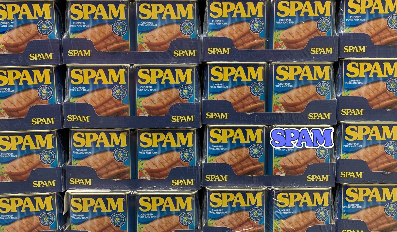 blogpost-image of stacked cans of spam with one illustrated word: spam 