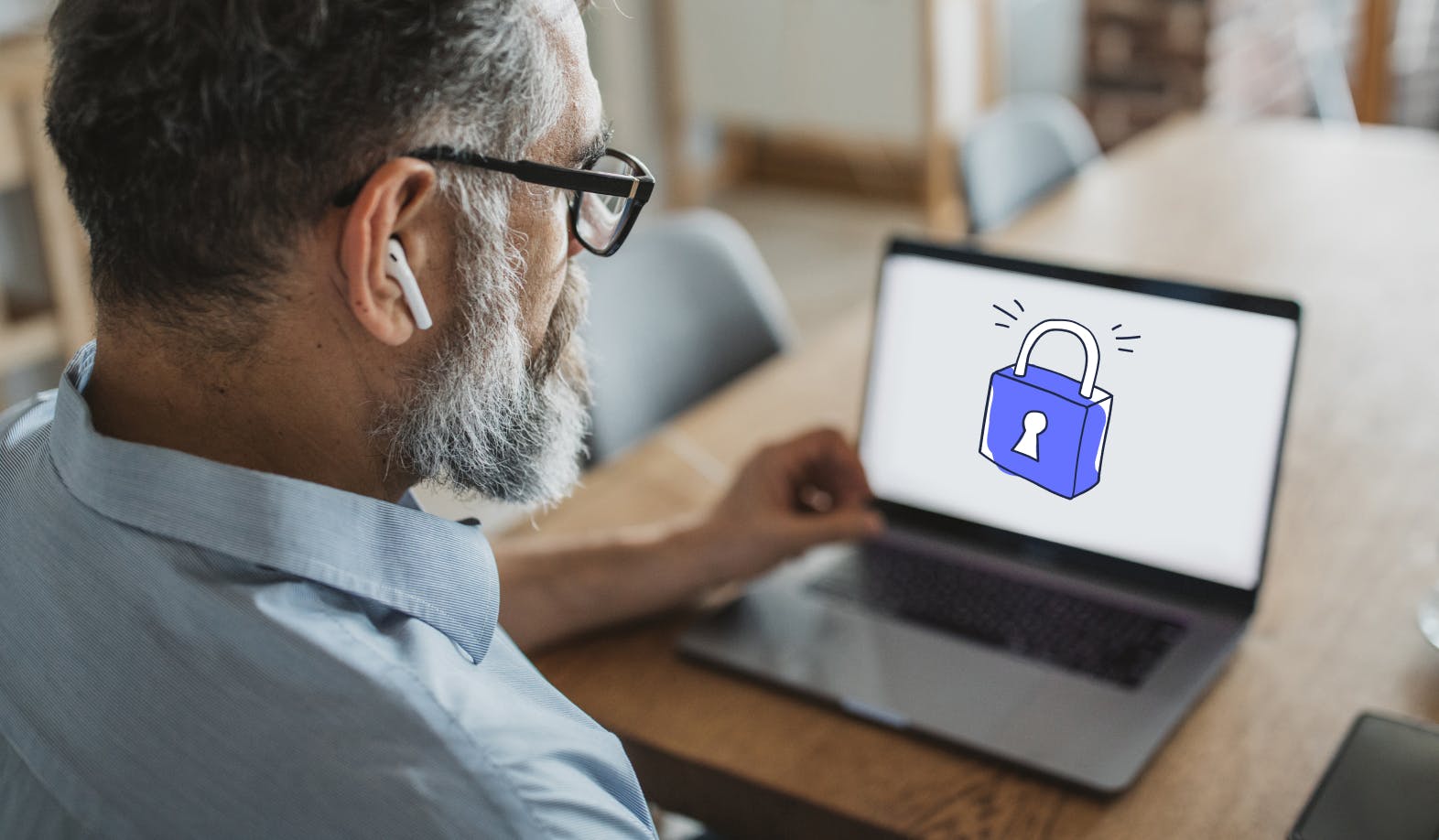 blogpost-image of a man looking at his laptop screen with an illustrated lock