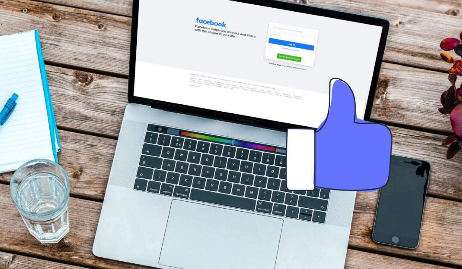blogpost-image of a laptop displaying a facebook log in screen and a tumbs up icon