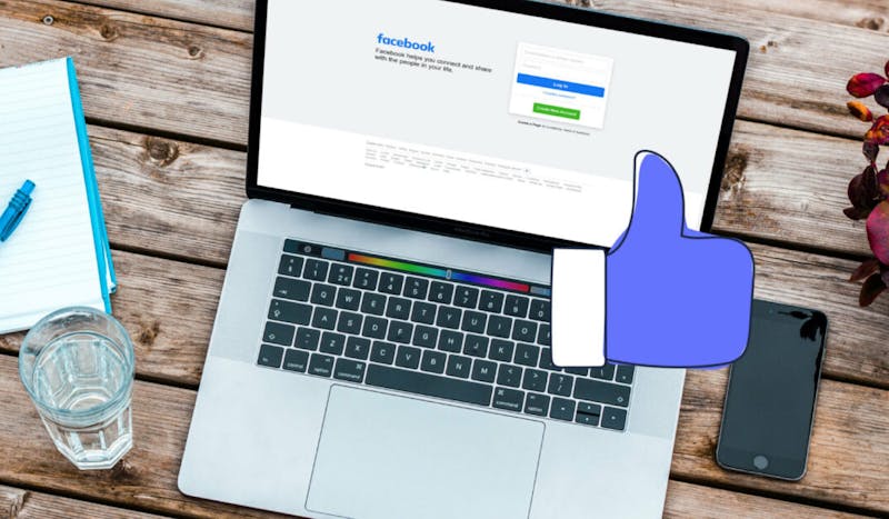 blogpost-image of a laptop displaying a facebook log in screen and a tumbs up icon