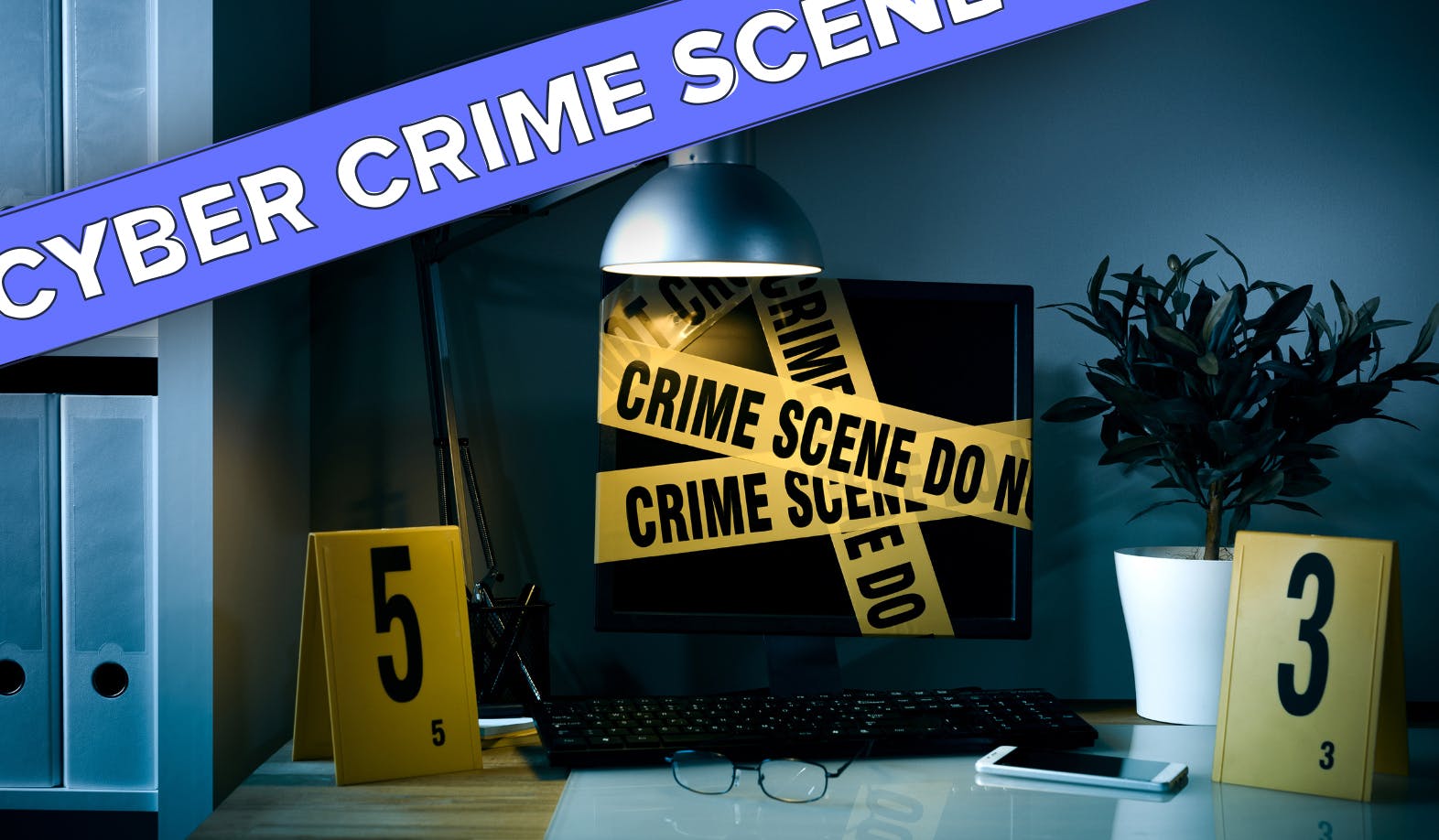 A photograph of a desk with office binders on the left. A desktop, keyboard, glasses and a phone in the middle. And a plant on the left. This working place is covered with yellow crime scene numbers and tape. The image has a dark and grim feel to it. The is also a StartMail brand illustration across the image in the StartMail blue color with the text 'Cyber Crime Scene'.
